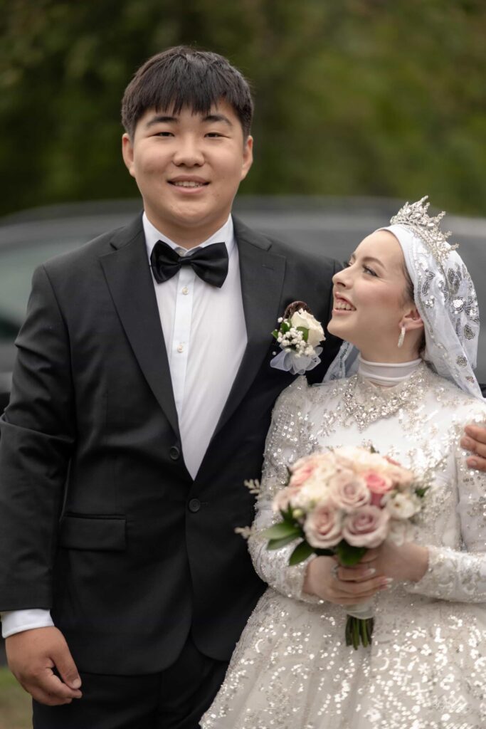 Bride and groom smiling and looking at each other on their wedding day in Gatineau.